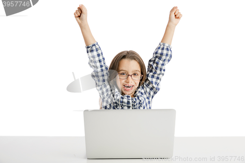 Image of Little girl working with a laptop