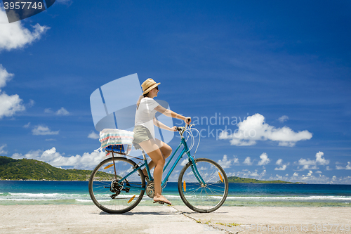 Image of Woman ride along The Beach