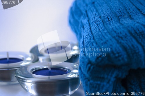 Image of blue towel and three candles
