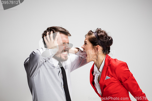 Image of The business man and woman communicating on a gray background