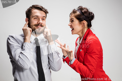 Image of The business man and woman communicating on a gray background