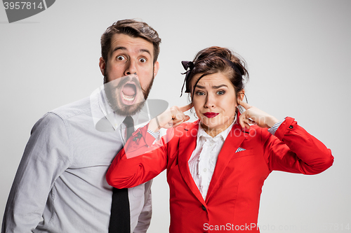 Image of The business man and woman communicating on a gray background