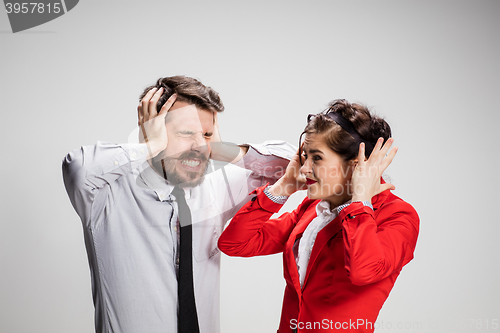 Image of The business man and woman communicating on a gray background
