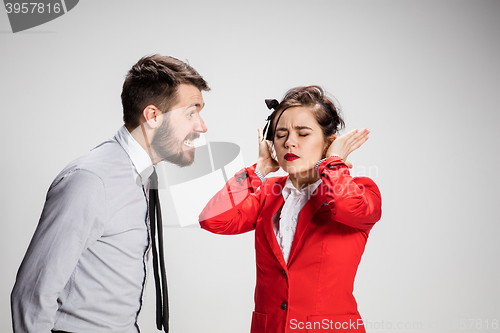 Image of The business man and woman communicating on a gray background
