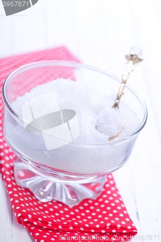 Image of white sugar in glass bank