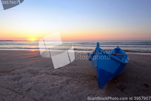 Image of Blue boat on beach