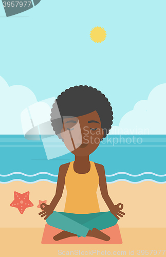 Image of Woman meditating in lotus pose.