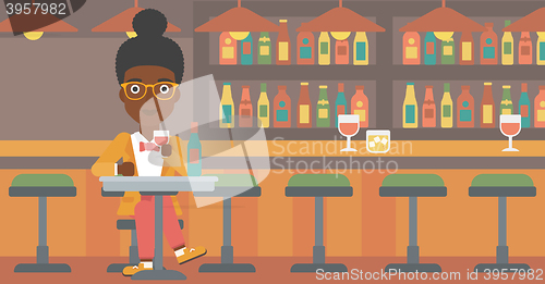 Image of Woman sitting at bar.