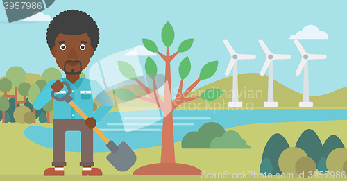 Image of Man plants tree.