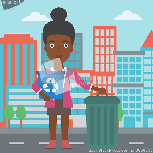Image of Woman with recycle bins.