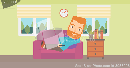 Image of Man lying on sofa.