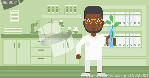Image of Laboratory assistant with test tube.