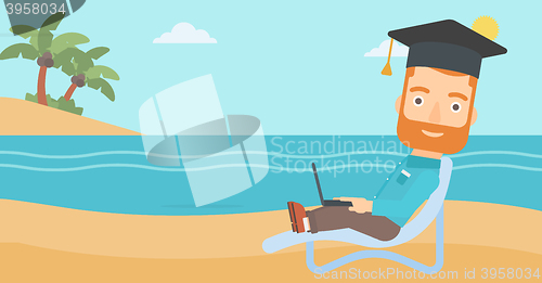 Image of Graduate lying on chaise lounge with laptop.