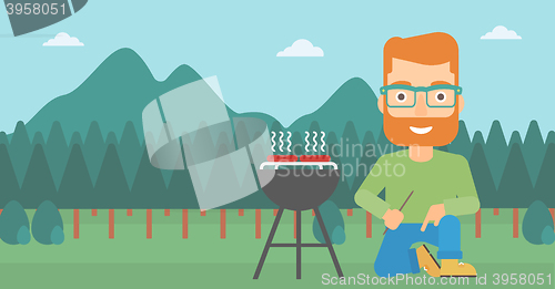 Image of Man preparing barbecue.
