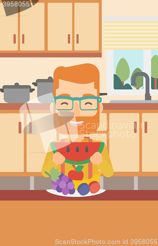Image of Man eating watermelon.