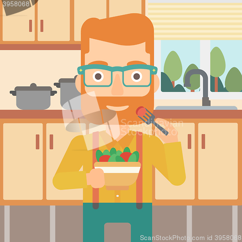 Image of Man eating salad.