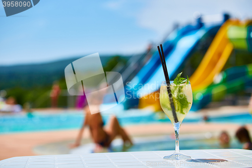 Image of Close up Cocktail margaritas with lime near the swimming pool