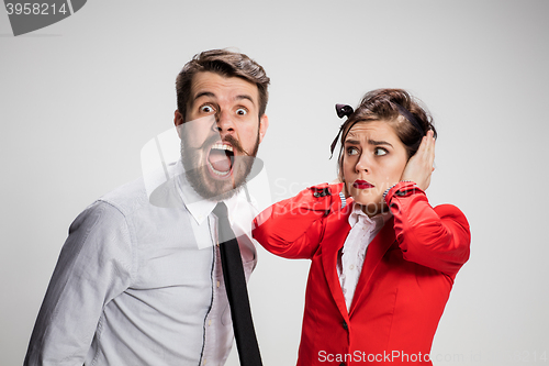 Image of The business man and woman communicating on a gray background