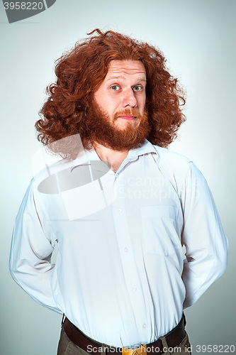 Image of Portrait of young man with shocked facial expression