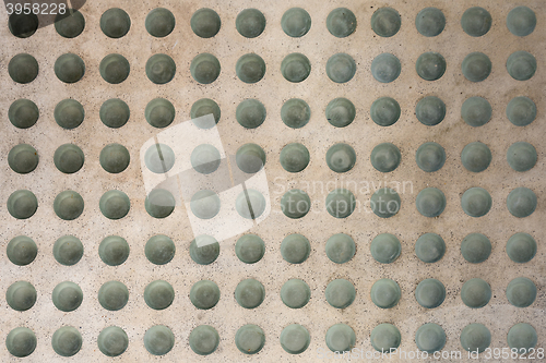 Image of Concrete floor with round glass inlets