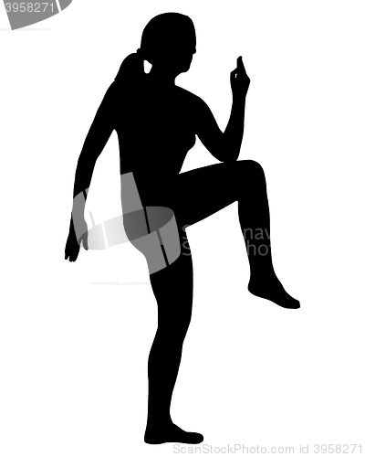 Image of Silhouette of woman doing exercises