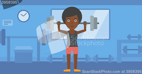 Image of Woman lifting barbell.