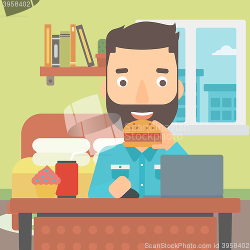 Image of Man eating hamburger. 