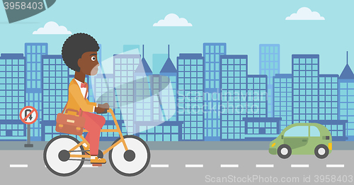 Image of Woman cycling to work.