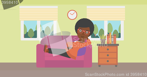 Image of Woman lying on sofa.