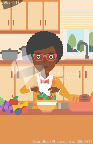 Image of Woman cooking vegetable salad.