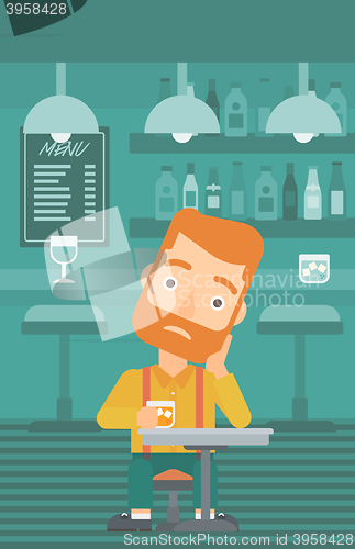 Image of Man sitting at bar.