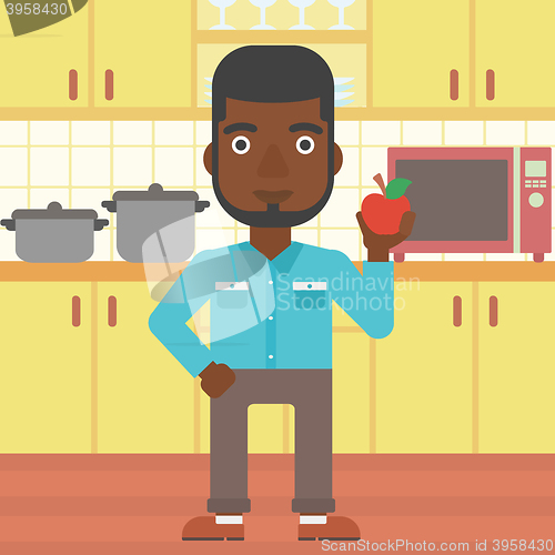 Image of Man holding apple.