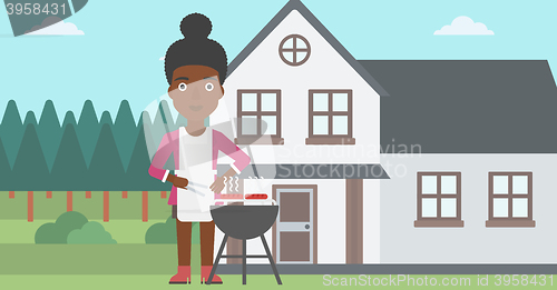 Image of Woman preparing barbecue.