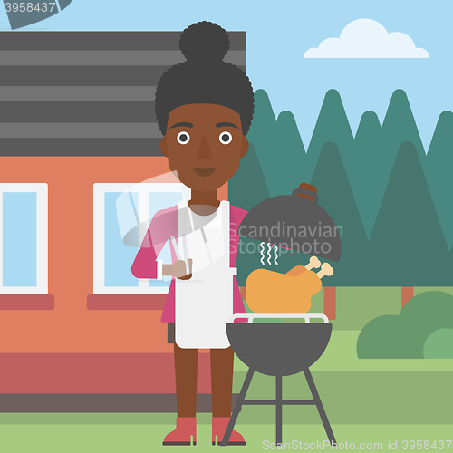 Image of Woman preparing barbecue.