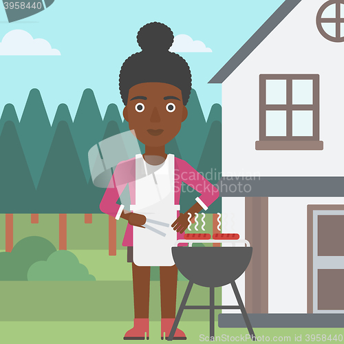 Image of Woman preparing barbecue.