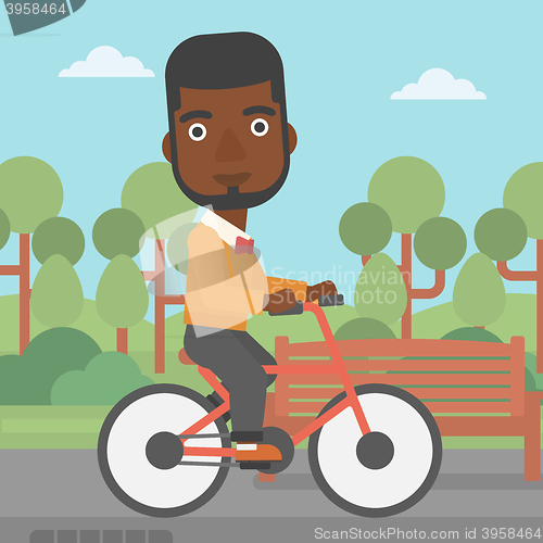 Image of Man riding bicycle.