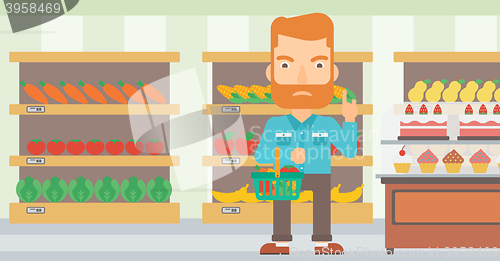 Image of Man holding supermarket basket.