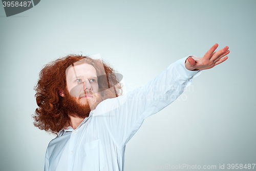 Image of The young man looking away playfully