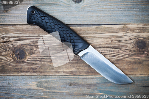 Image of hunting knife with a black handle