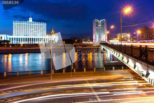 Image of Moscow, Russia. Night cityscape with Kalinin bridge and Moscow r