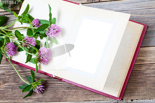 Image of album with open pages and blossom clover. mock up