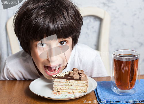 Image of boy and birthday cake