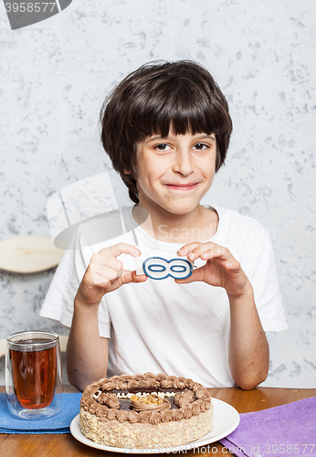 Image of boy birthday with a sign infinity