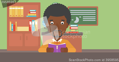 Image of Man reading book.