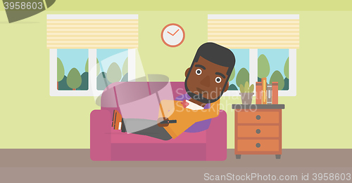 Image of Man lying on sofa.