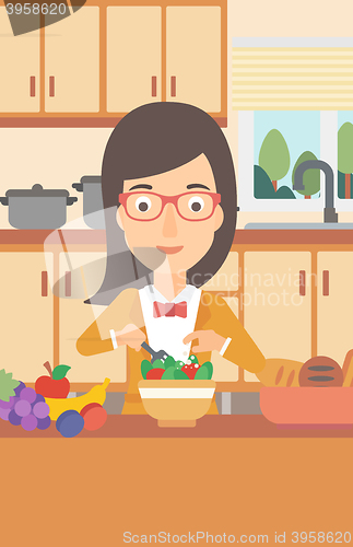 Image of Woman cooking vegetable salad.
