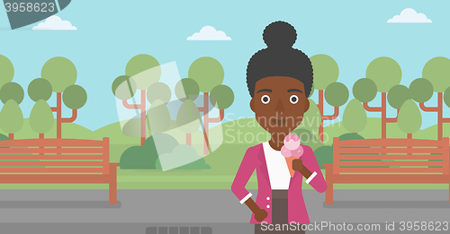 Image of Woman holding icecream.