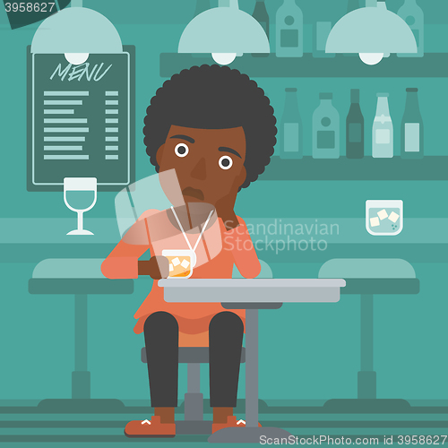 Image of Woman sitting at bar.