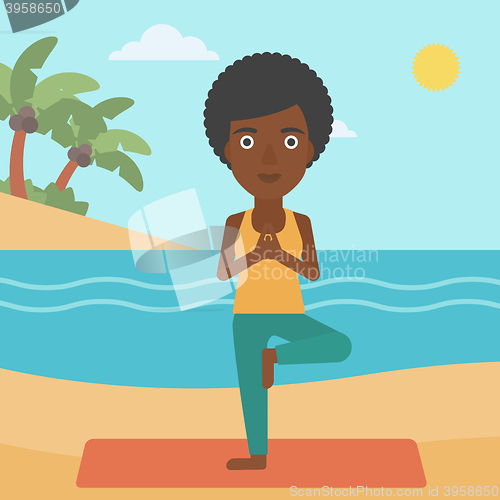 Image of Woman practicing yoga.