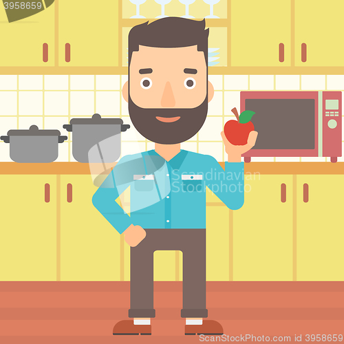 Image of Man holding apple.